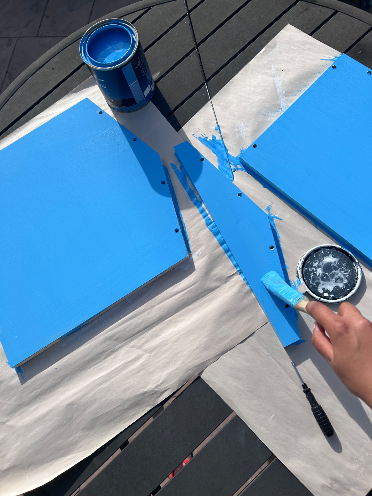 Freshly painted blue panels drying